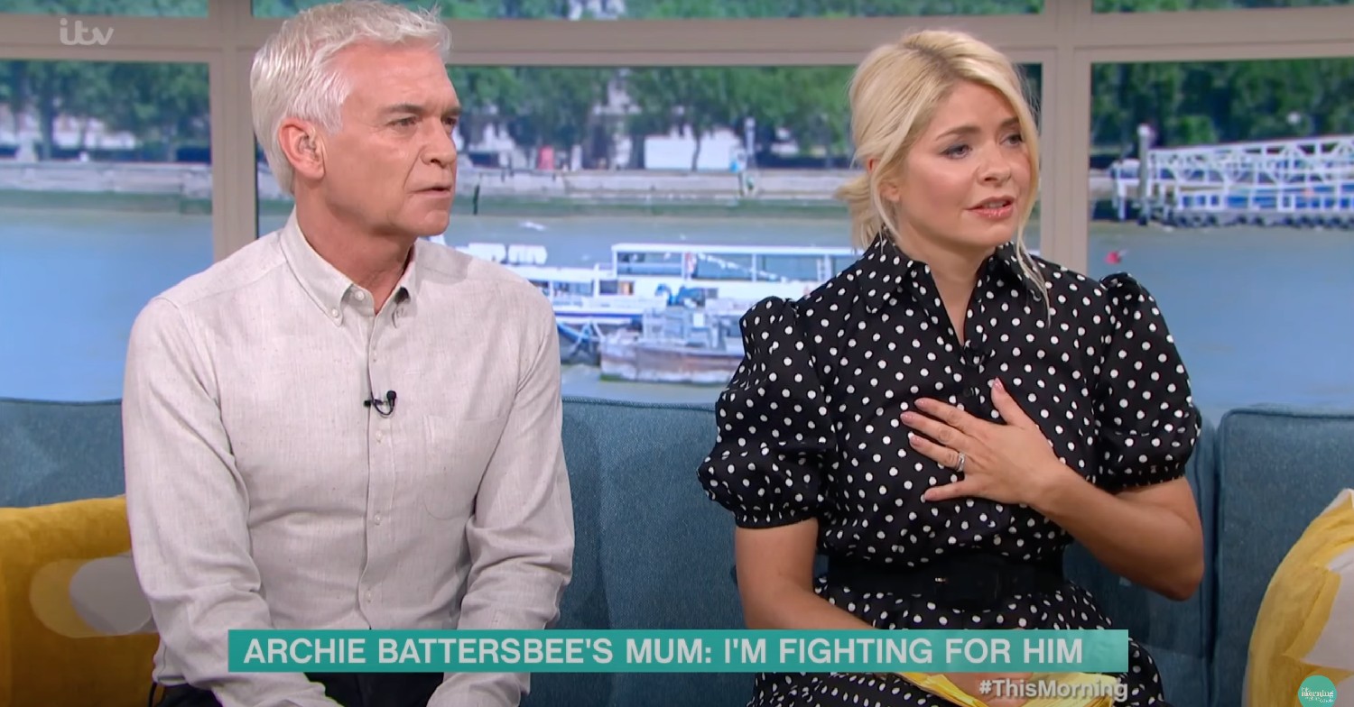 Phillip Schofield looking concerned and Holly Willoughby clutching her chest, looking sad on This Morning today
