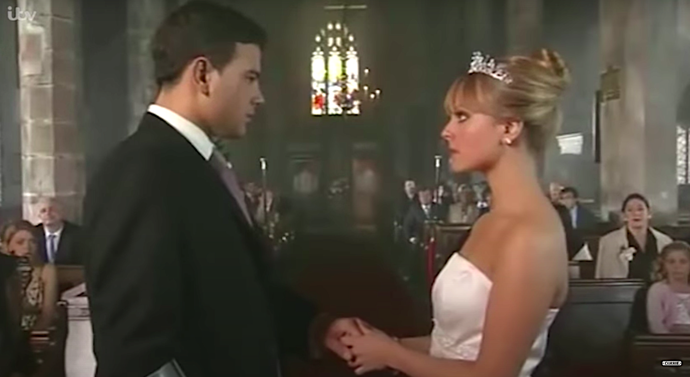 Coronation Street Jason and Sarah look serious as they get married