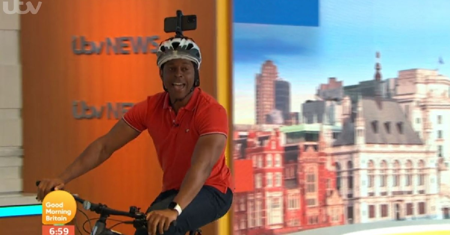 Andi Peters riding a bike inside GMB studios today