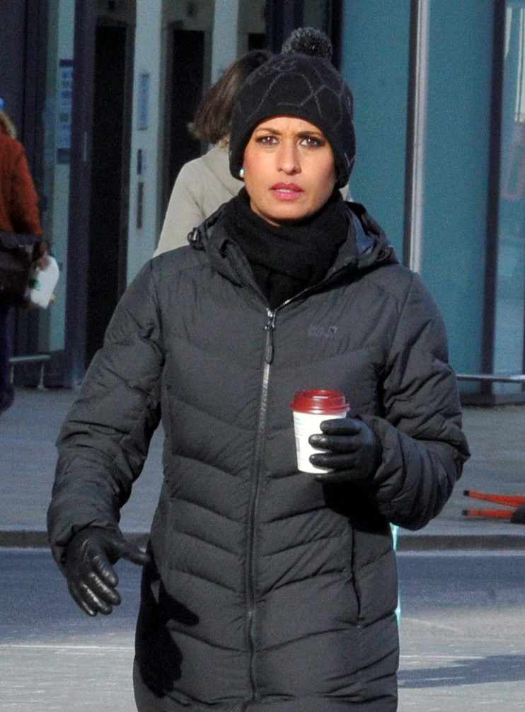 Naga Munchetty wearing a hat and holding a coffee outside BBC Studios