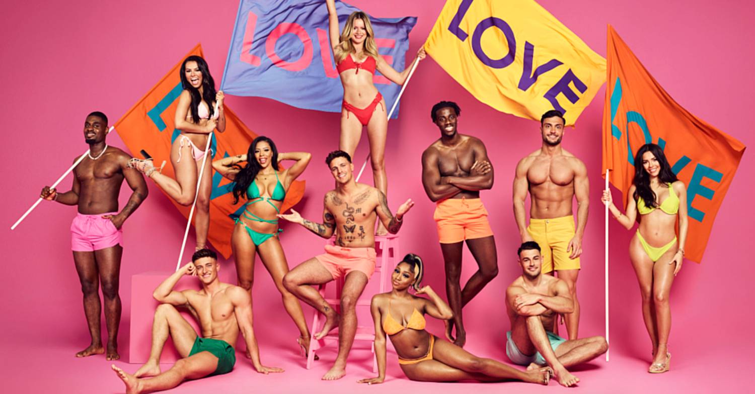 Love Island 2022 cast members pose and hold flags