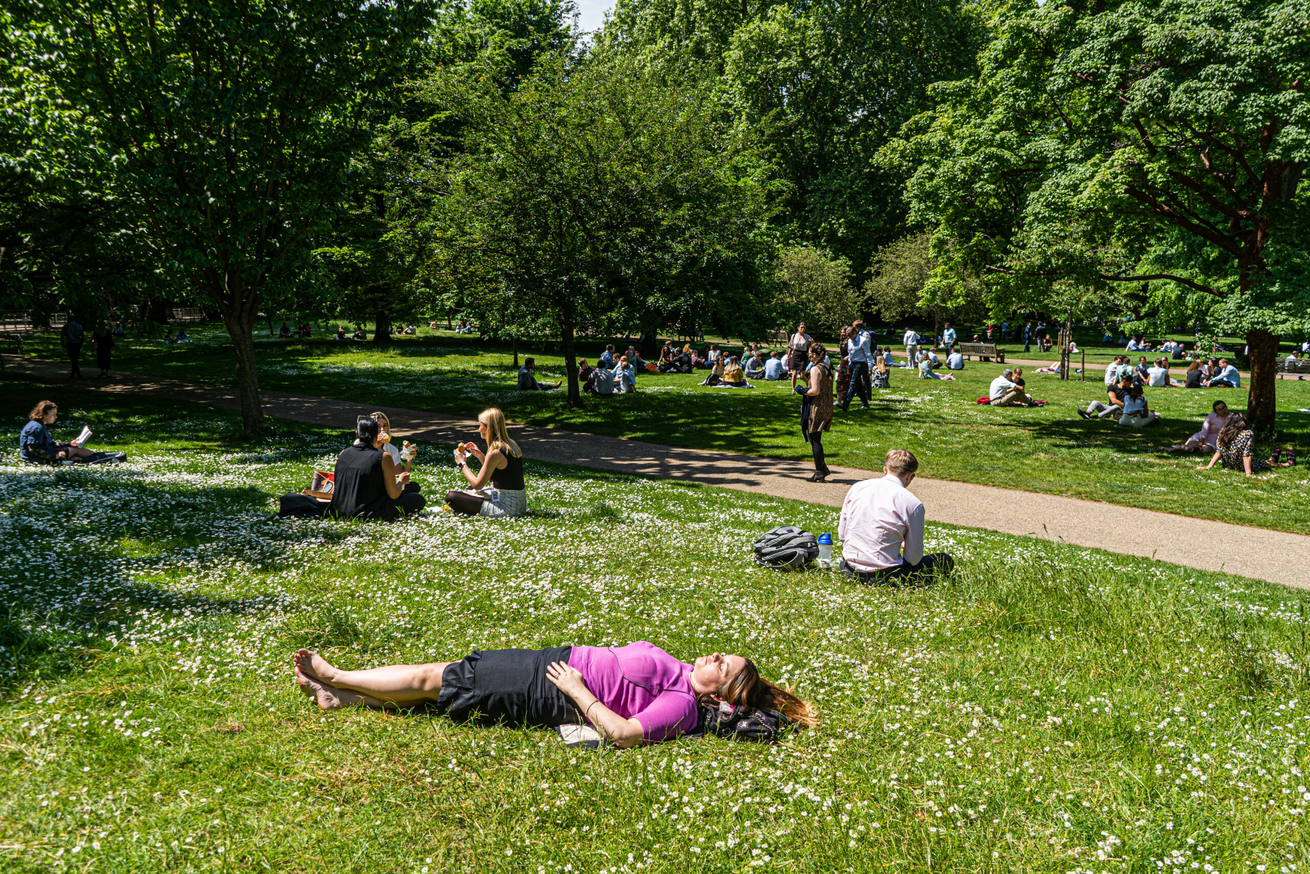 People sunbathing in a UK heat wave