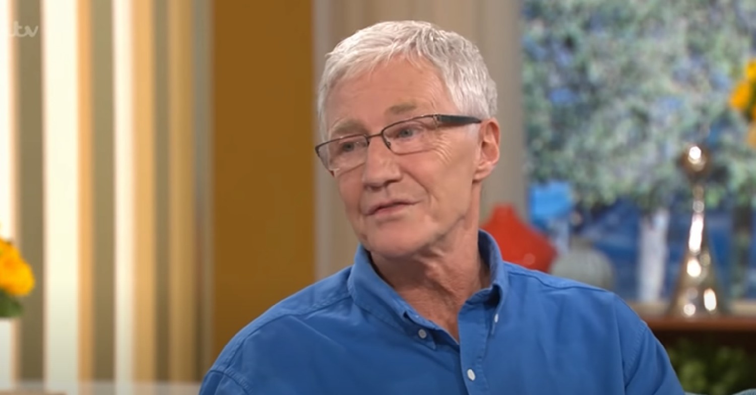 Paul O'Grady in blue shirt talking during This Morning interview