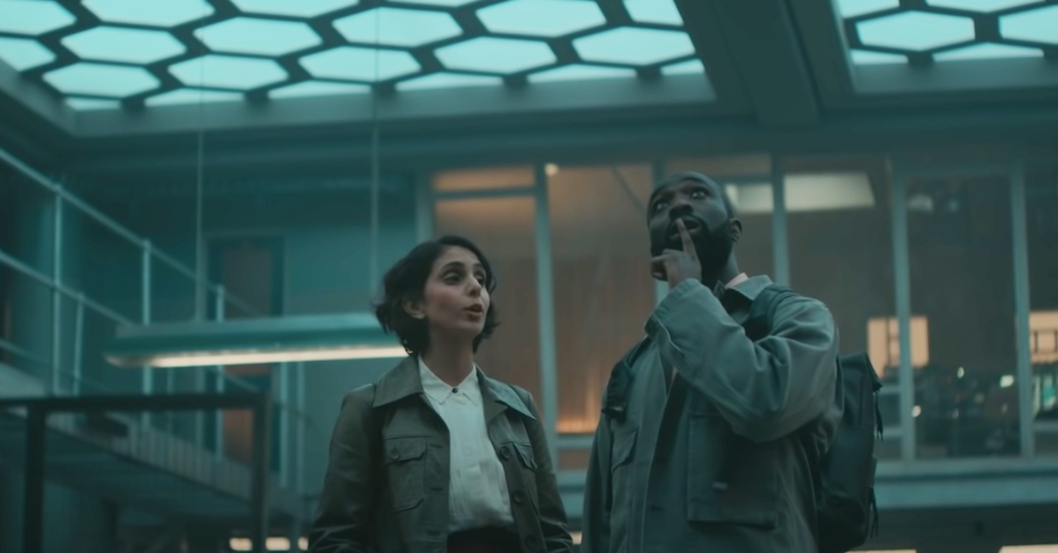 Paapa Essiedu and Anjil Mohindra looking up on The Lazarus Project