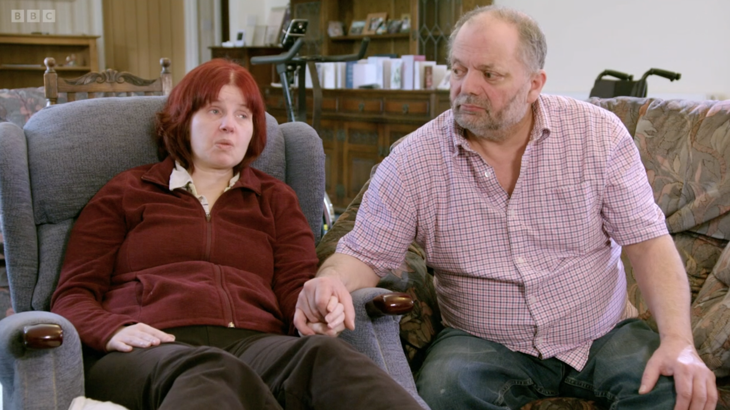 A grieving family looking solemn on DIY SOS