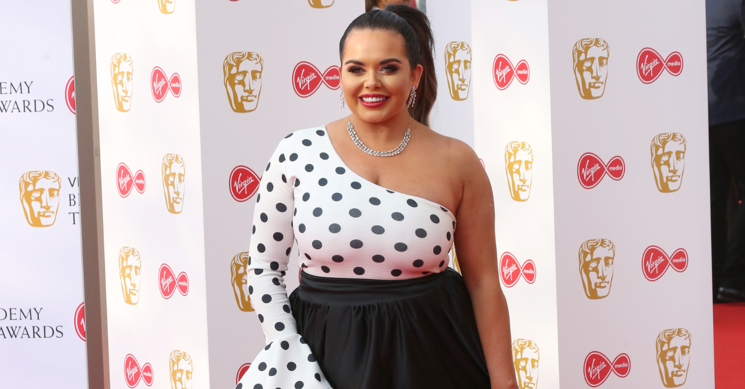Scarlett Moffatt smiles to camera