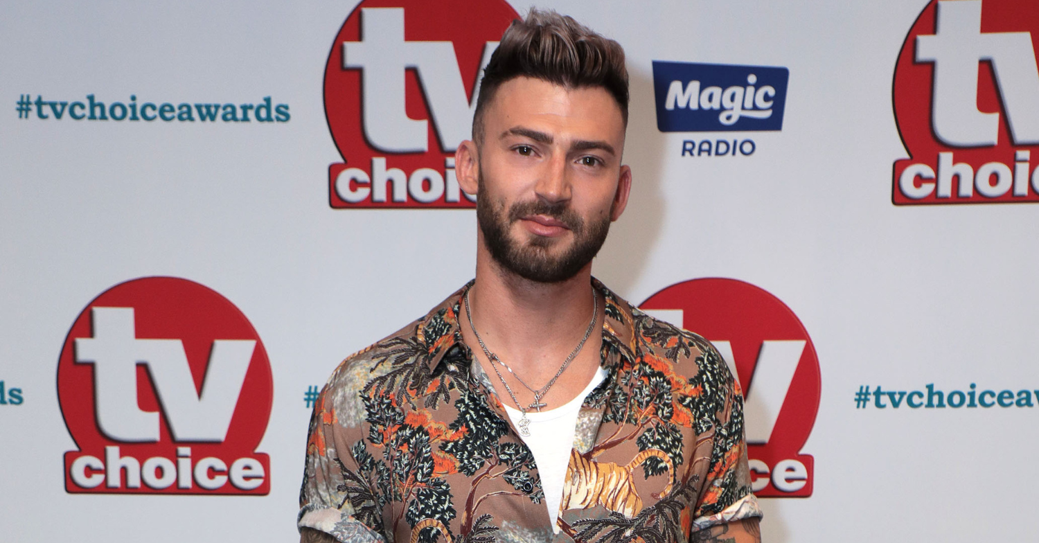 Jake Quickenden smiles on red carpet