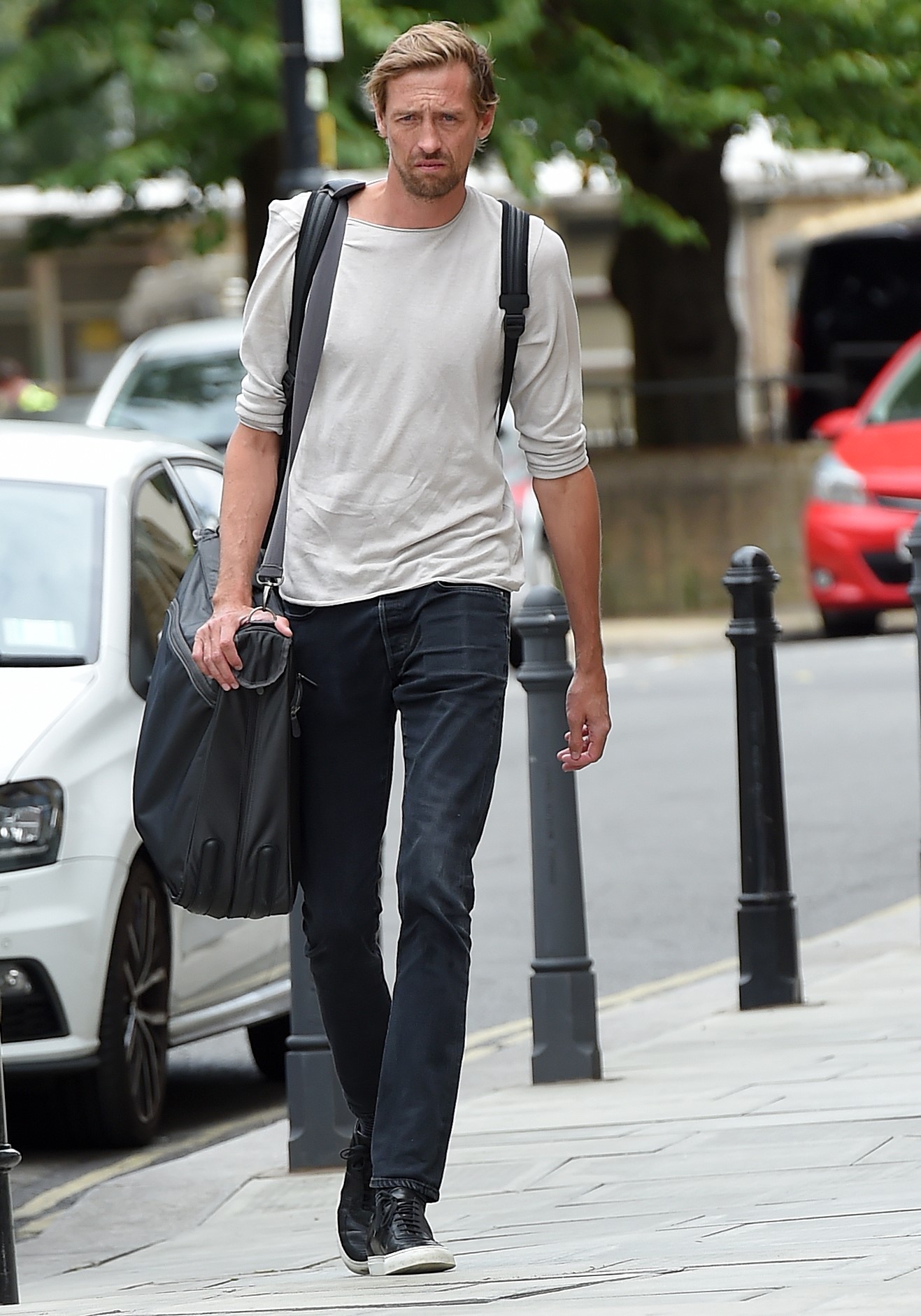 Peter Crouch looks serious during outing