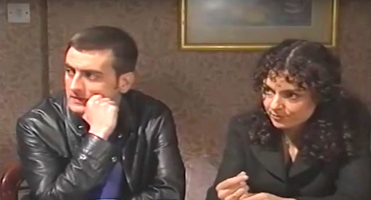 Peter and Susan Barlow look worried as they sit side by side in Coronation Street