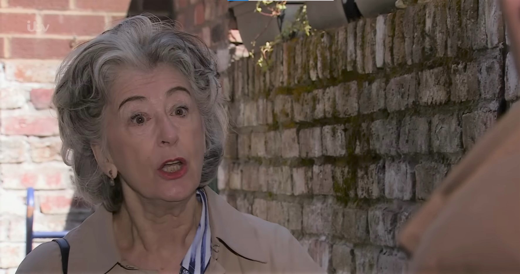 Coronation Street Evelyn looks worried as she tries to distract Brian