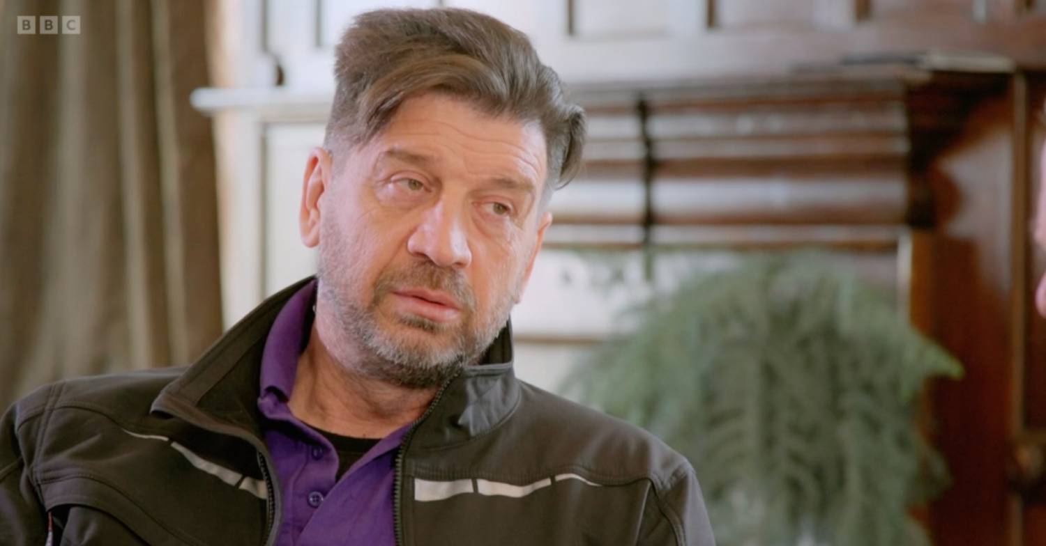 Nick Knowles, host of DIY SOS, listens
