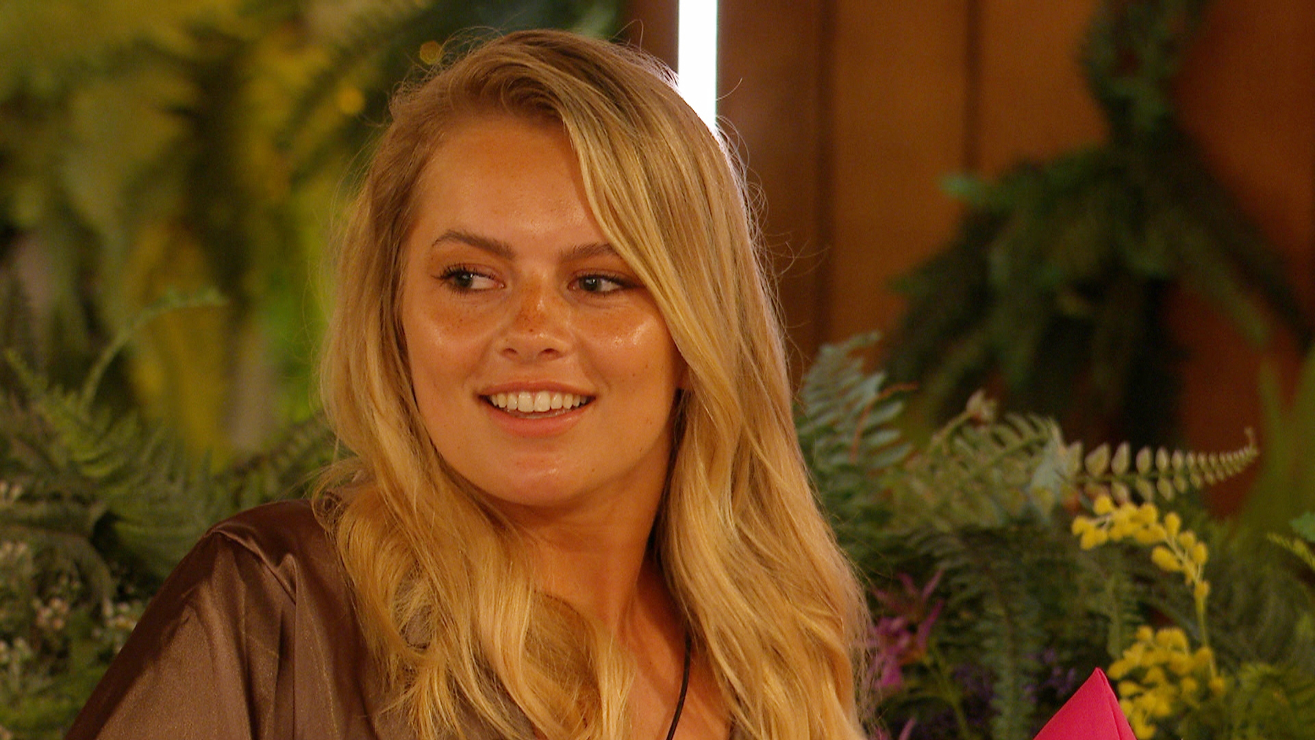 Tasha from Love Island smiles