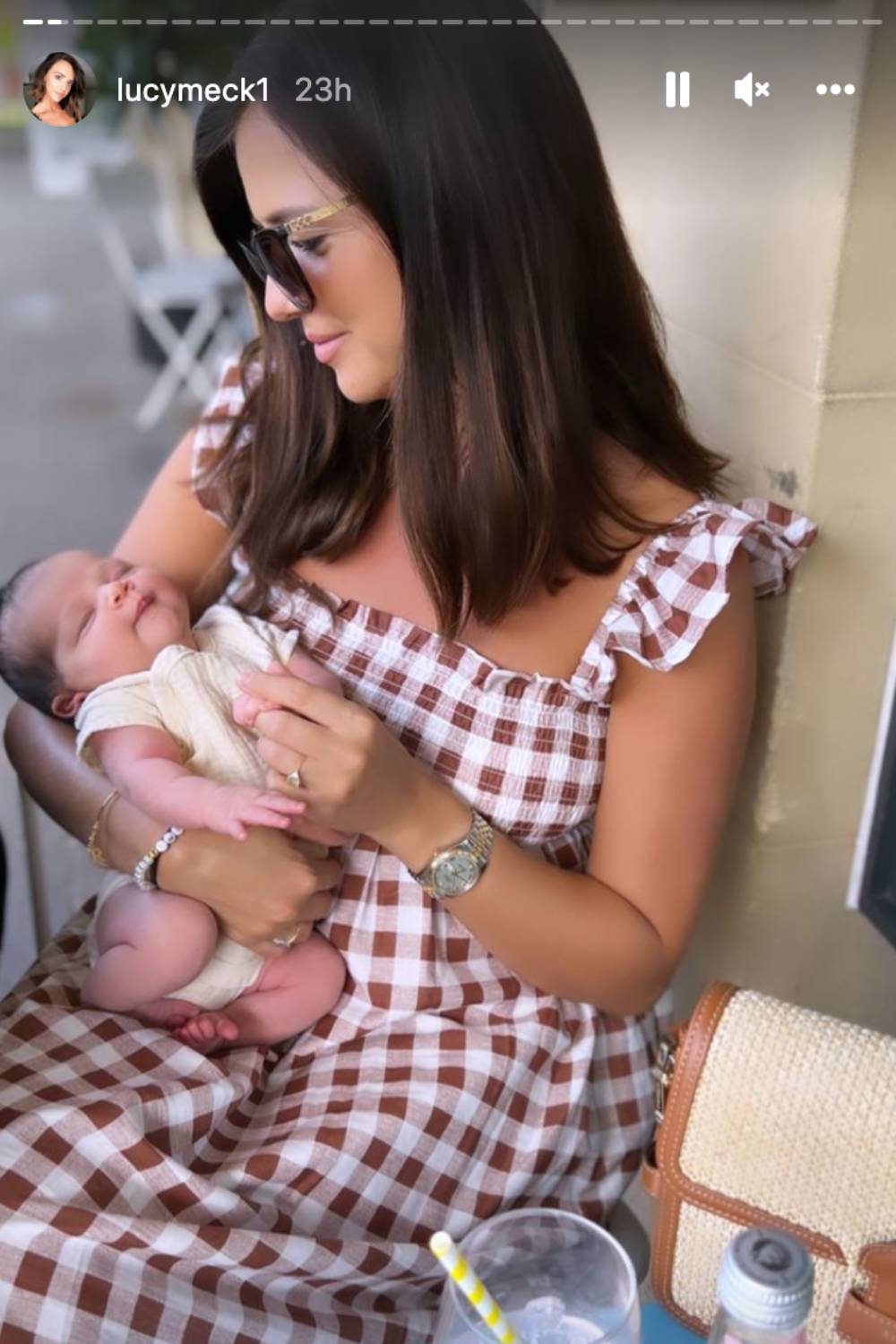 Lucy Mecklenburgh tends to her baby
