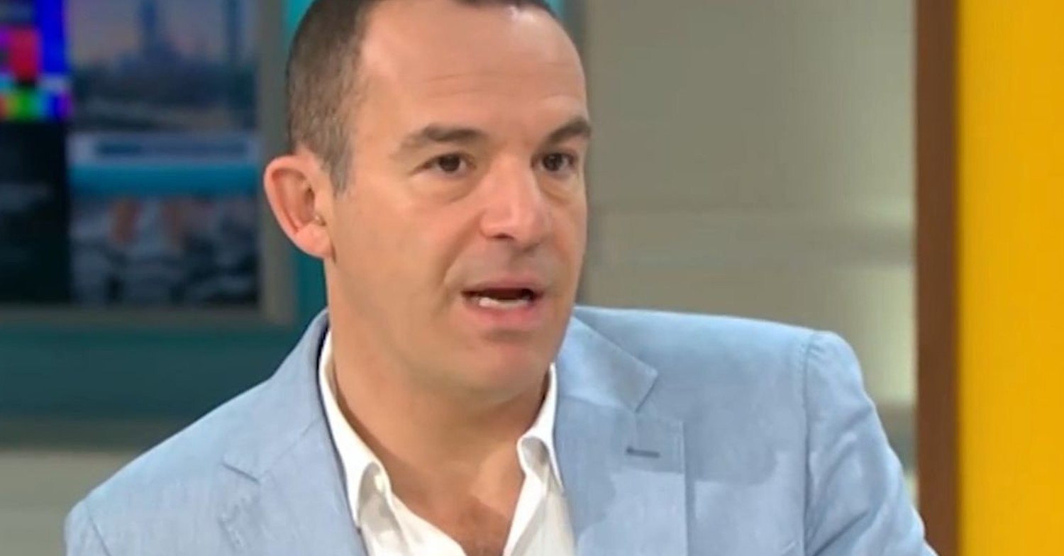 Martin Lewis in a blue Suit chatting on GMB
