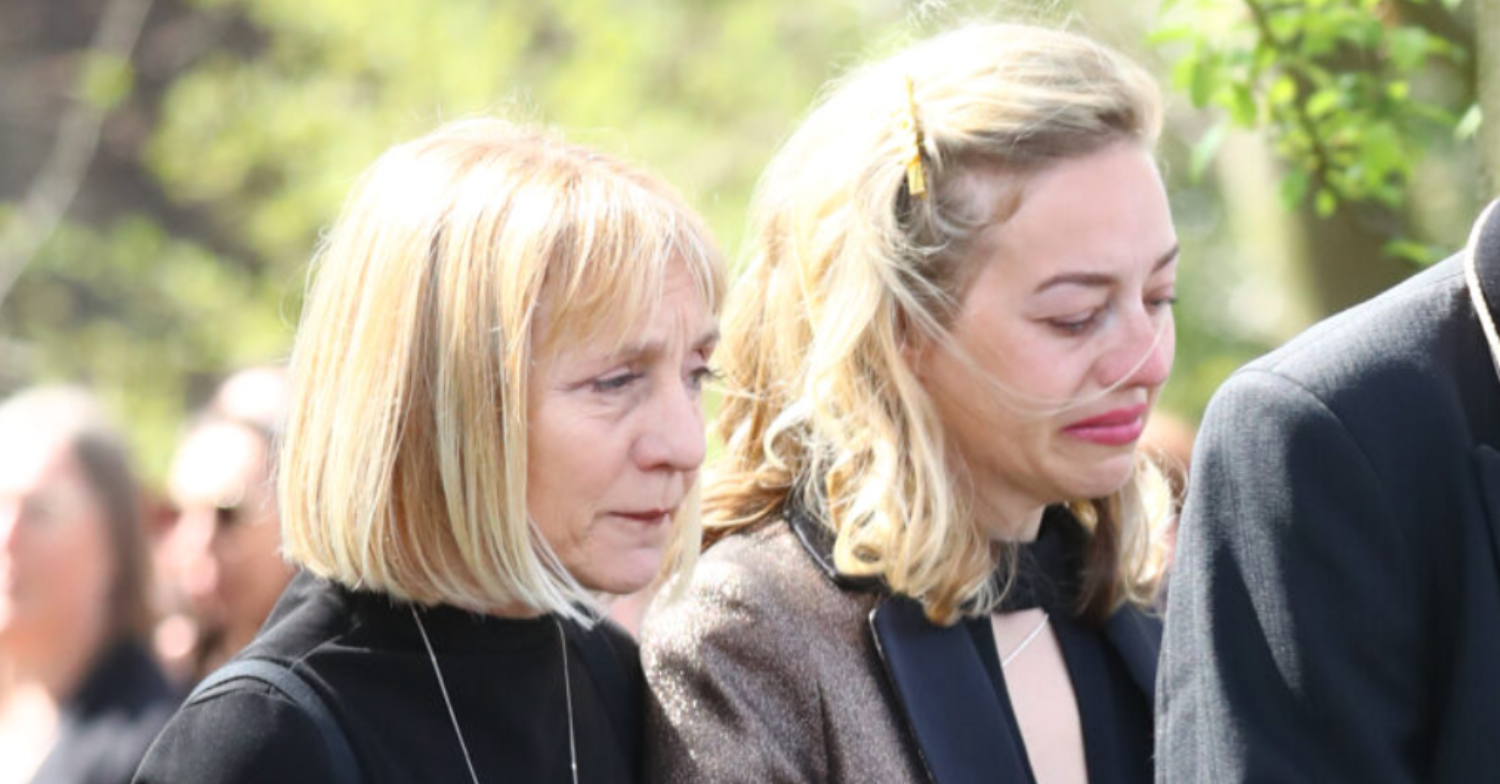 Kelsey being comforted at Tom Parker's funeral