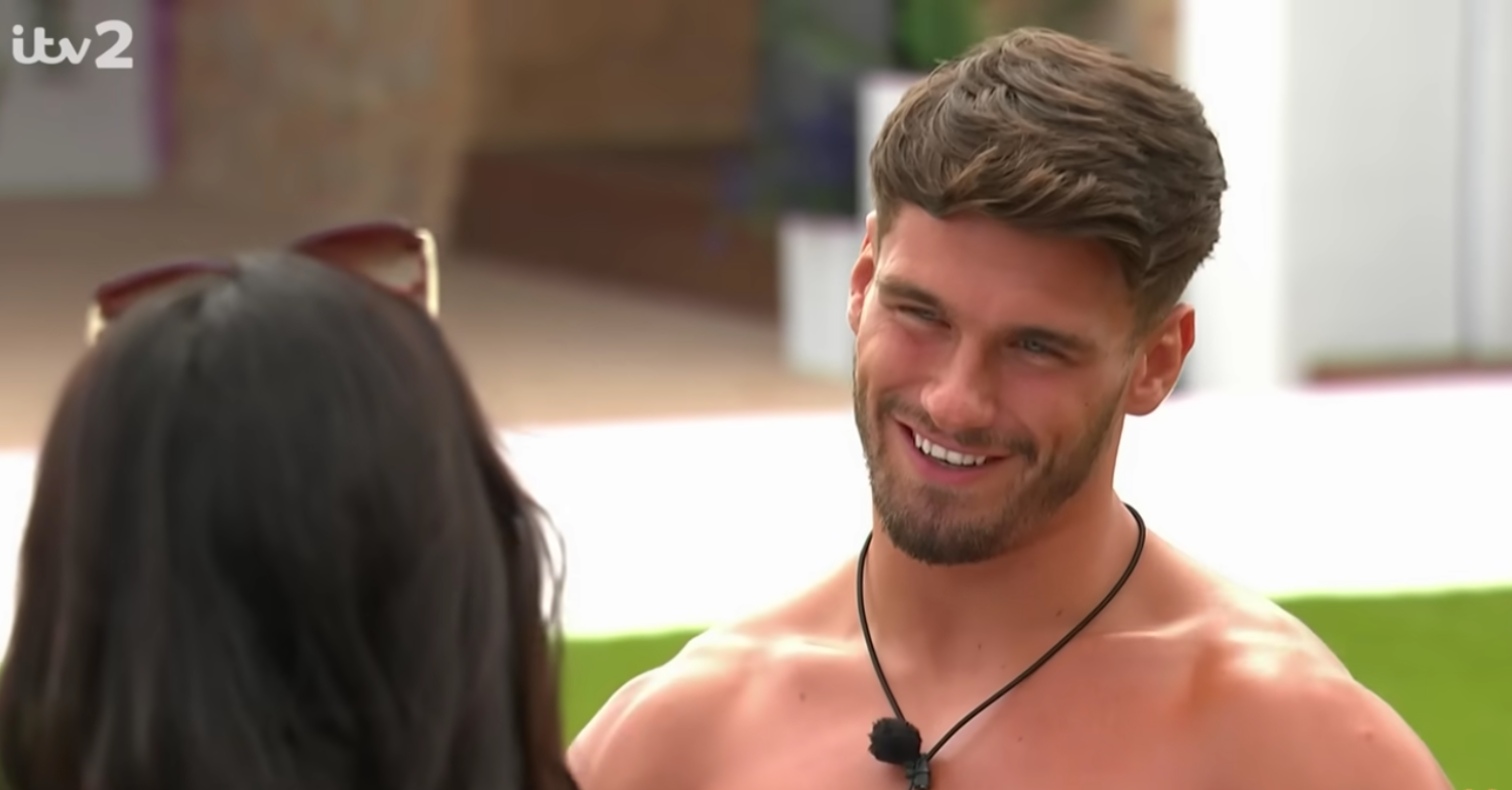 Jacques smiling on a date with Paige on Love Island