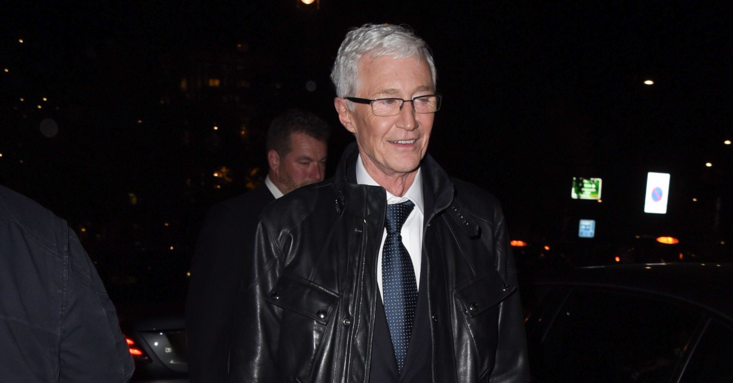 Paul O'Grady smiling during outing