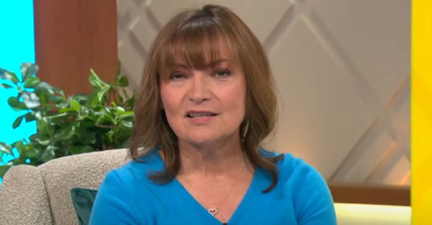 Lorraine Kelly speaking to the camera in blue outfit on ITV show