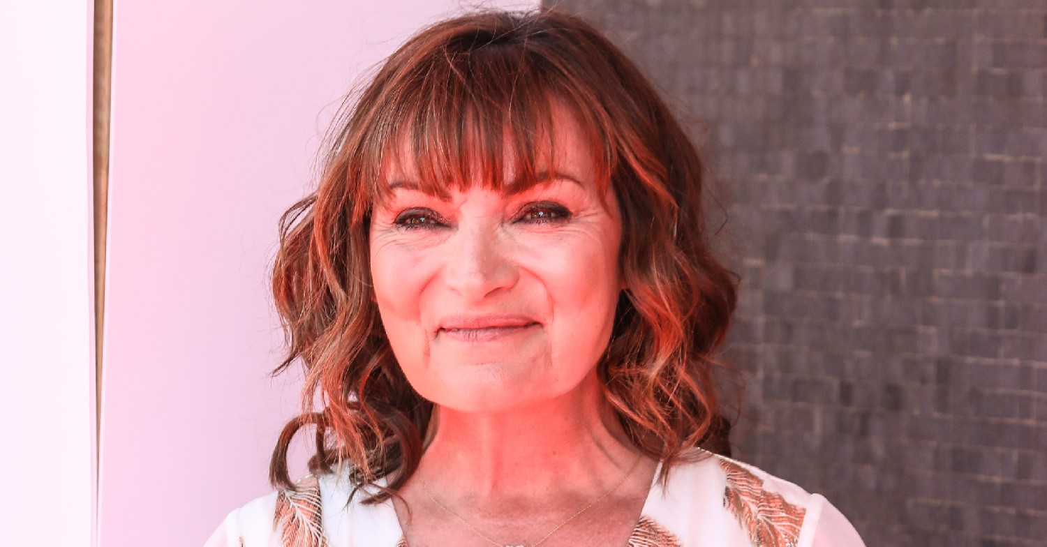 Lorraine Kelly smiles in white floral dress at BAFTAs