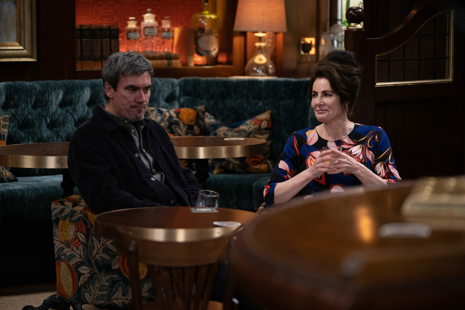 Cain looks grumpy and Faith looks happy in Emmerdale