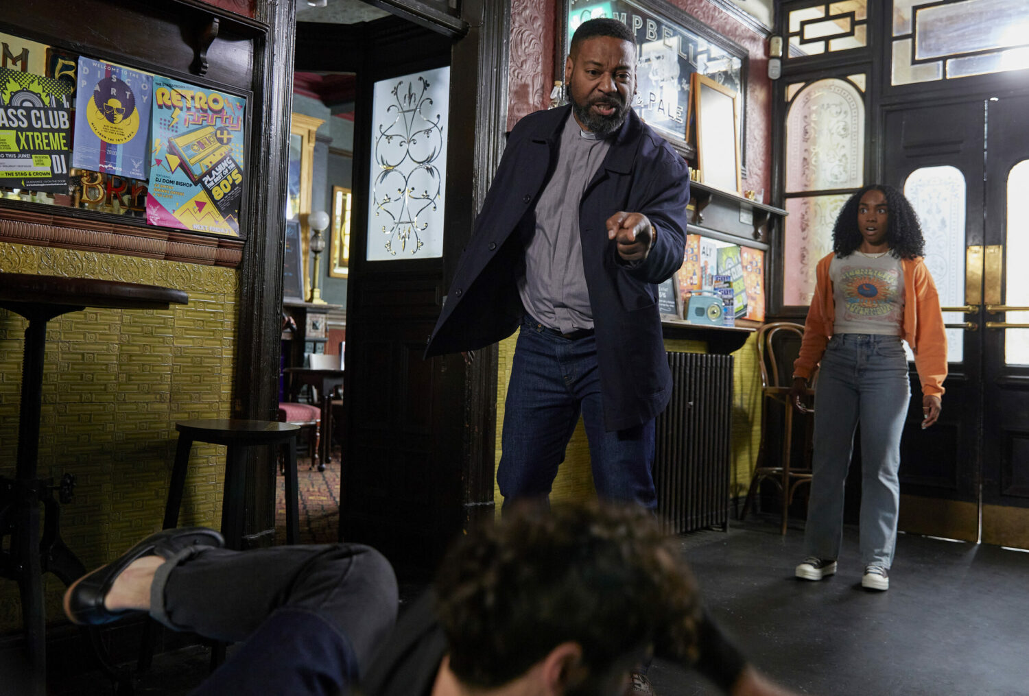 Charles pointing to someone on the floor in Emmerdale