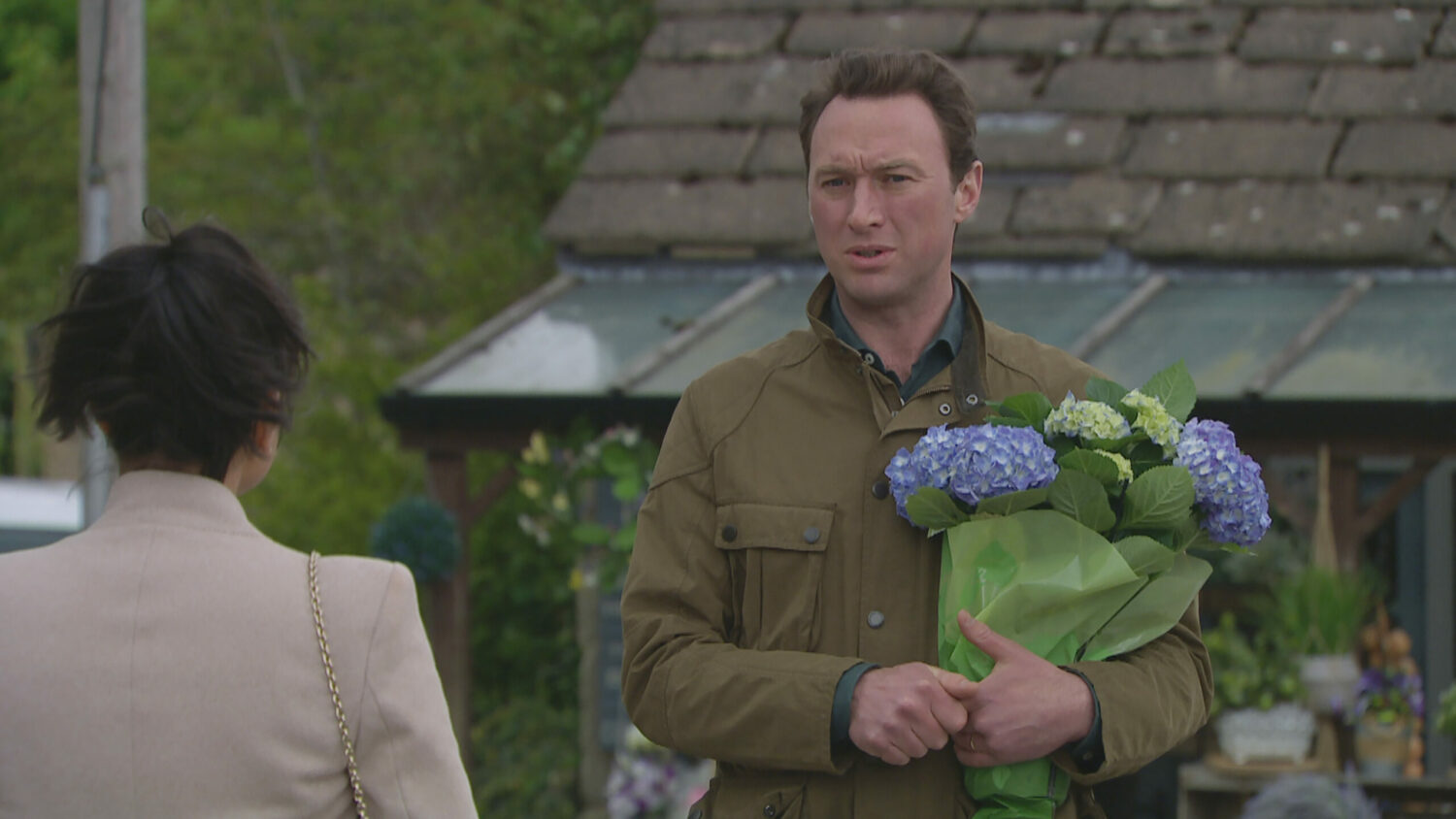 Liam holding flowers Emmerdale