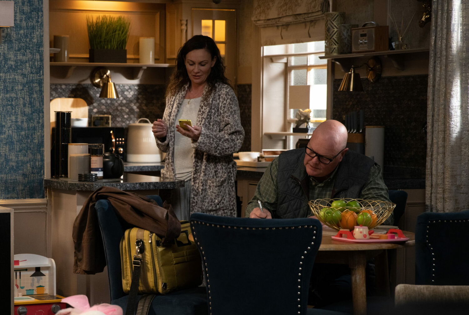 Chas looking at her phone in Emmerdale