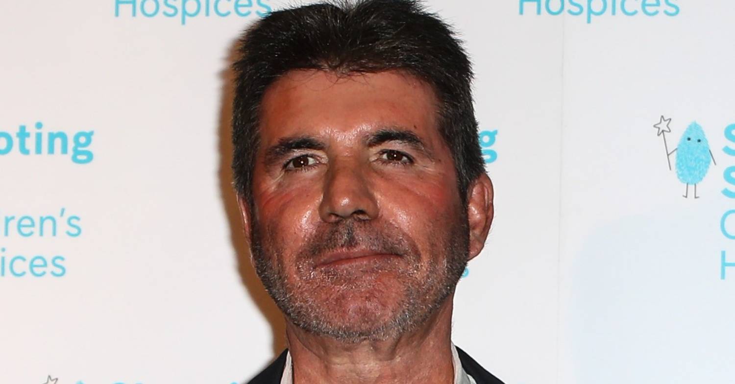 Simon Cowell looks impassive