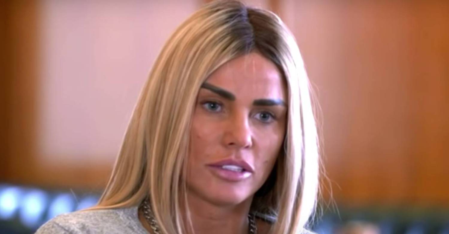 Katie Price with an impassive expression