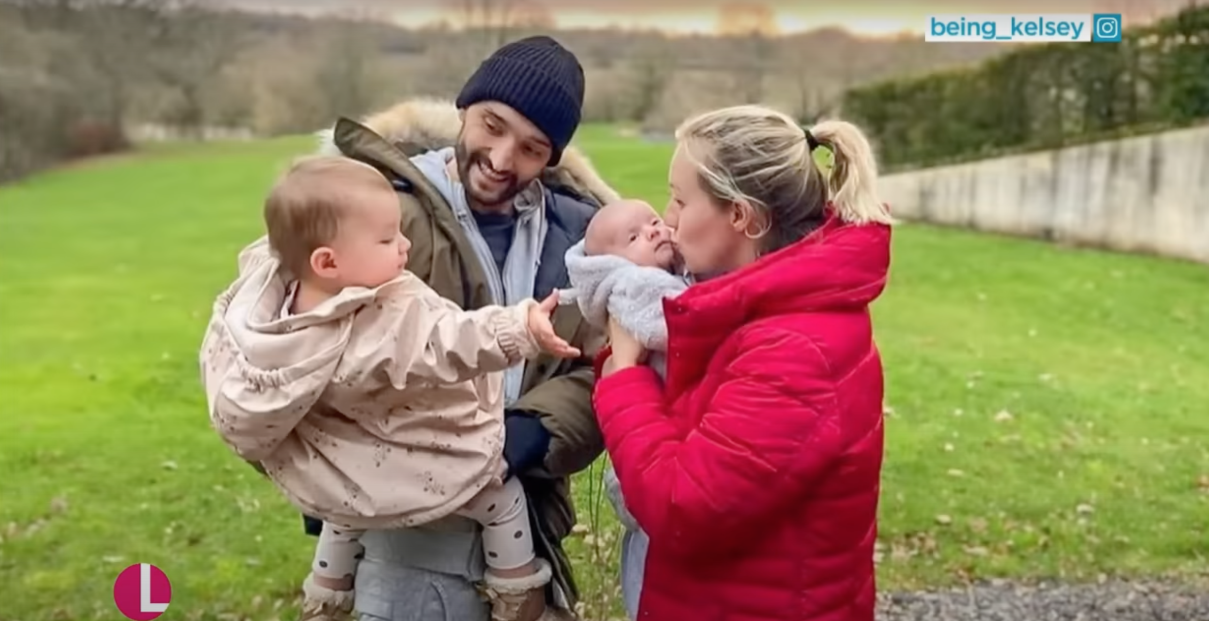 Tom and Kelsey Parker cuddling their kids