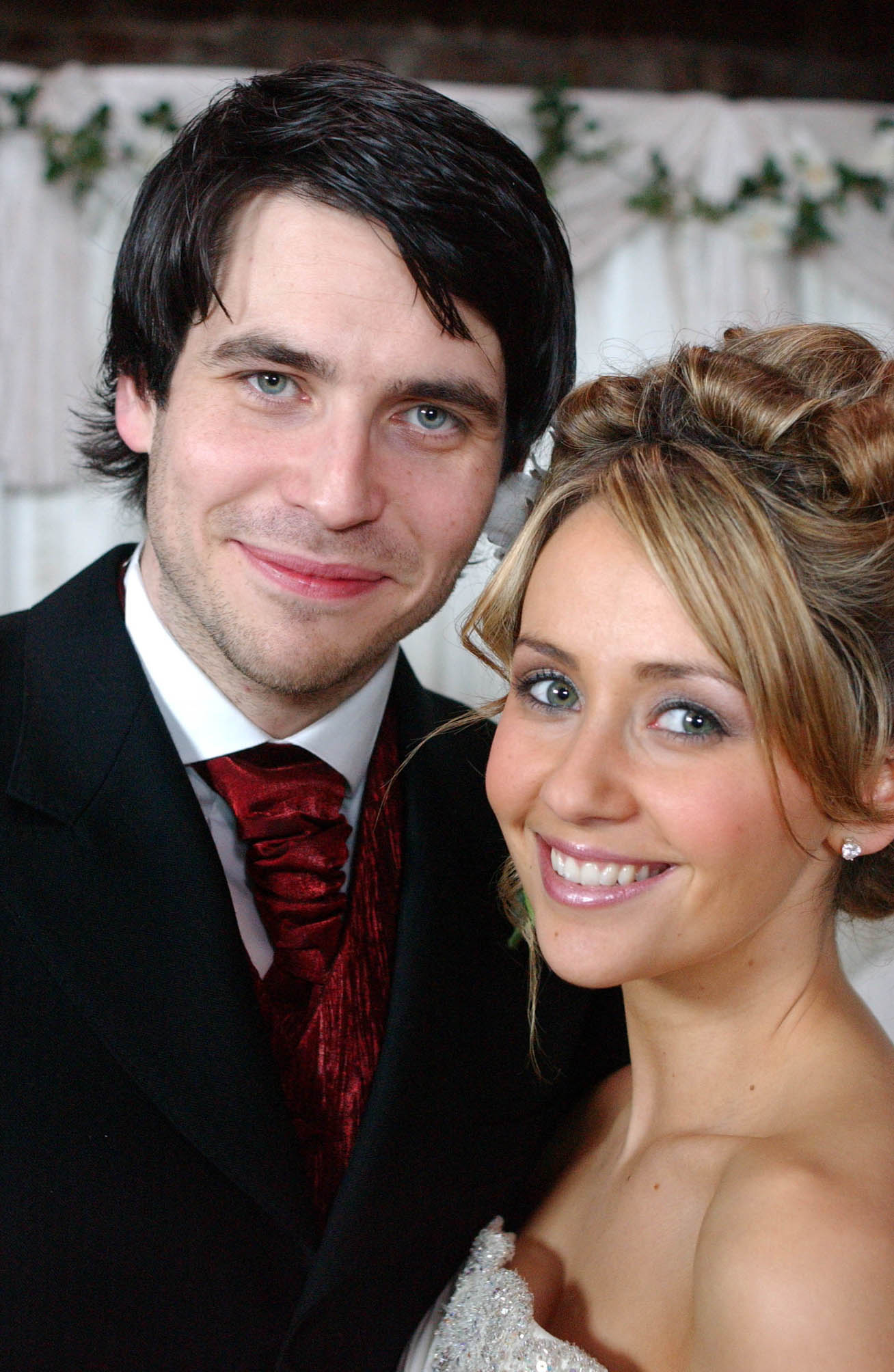Coronation Street Liam and Maria Connor smile happily for a wedding picture