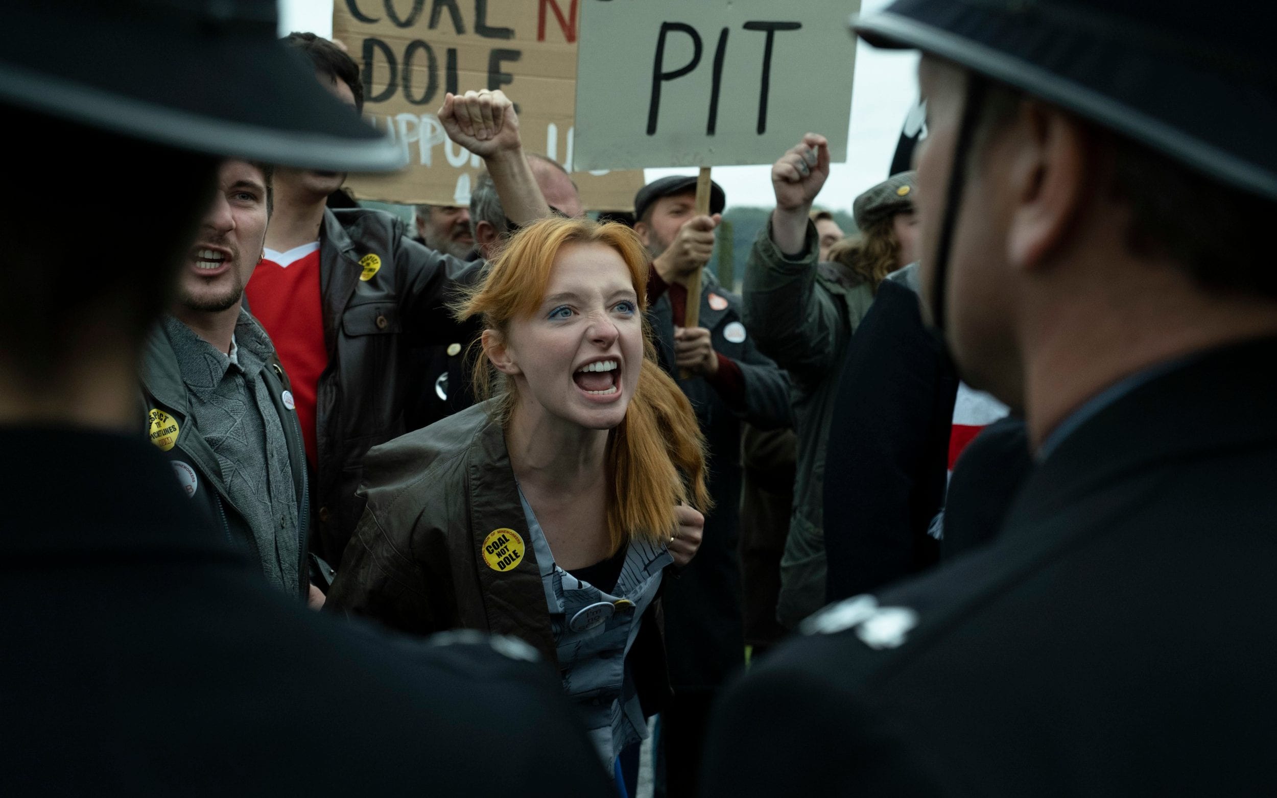 a woman shouts at a policeman in Sherwood