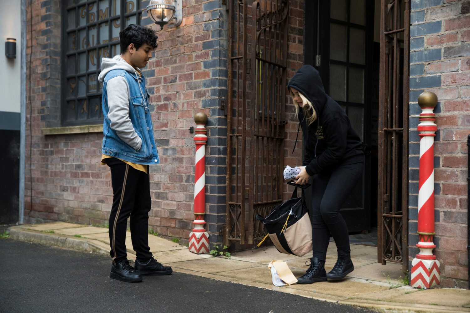 Coronation Street Aadi is shocked to see Kelly with a wad of cash as she comes out of the barbers