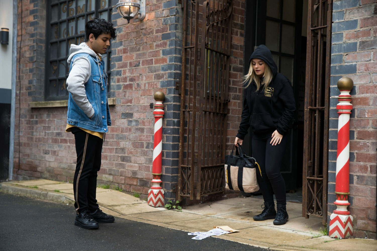 Coronation Street Aadi is shocked to see Kelly with a wad of cash as she comes out of the barbers