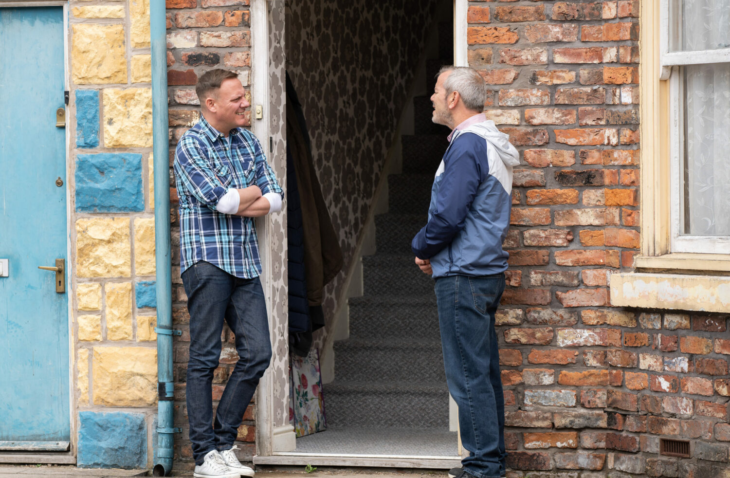 Sean and Frank talk outside the house in Coronation Street