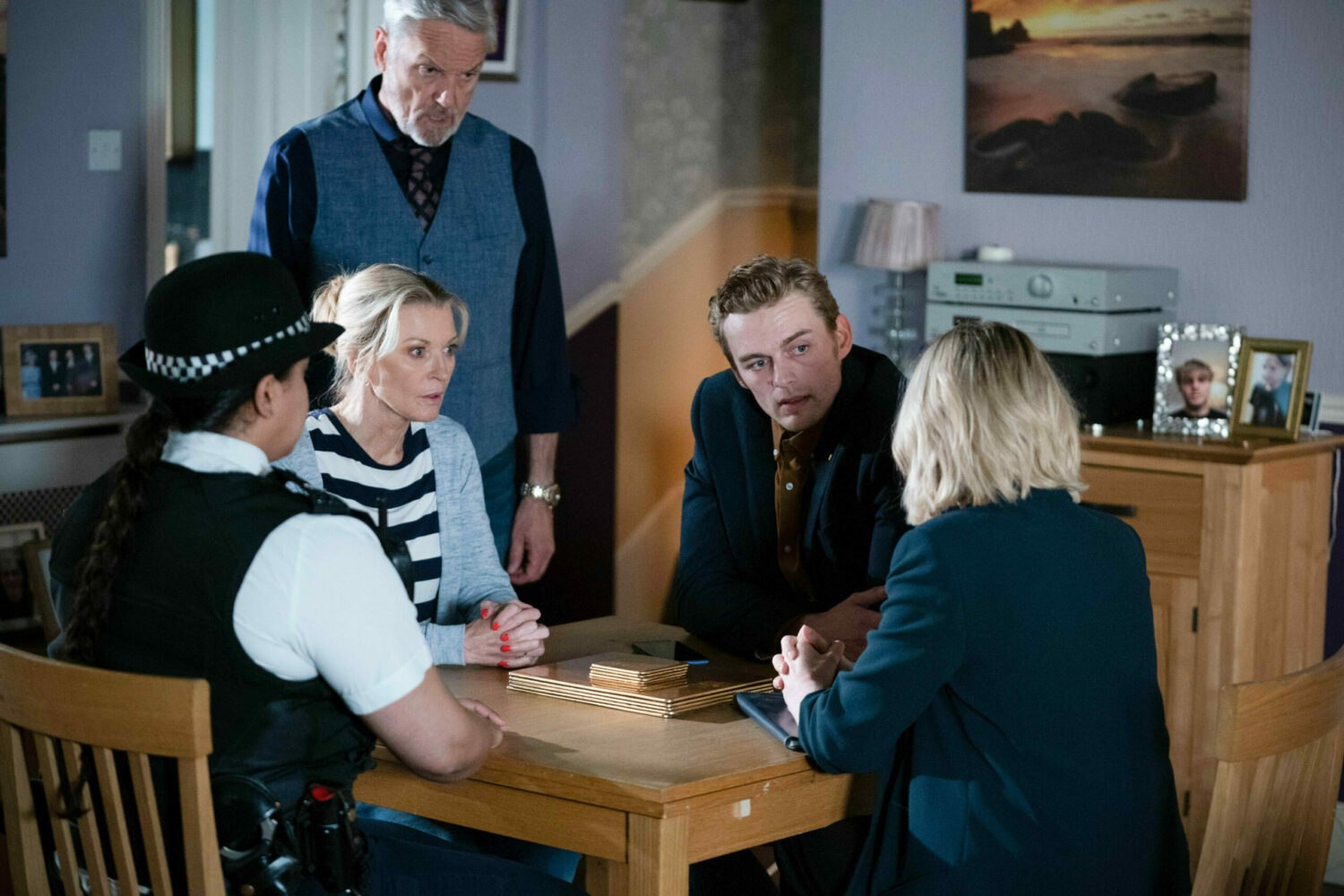 EastEnders Kathy, Peter and Rocky listen as the police update them on Peter's assault case