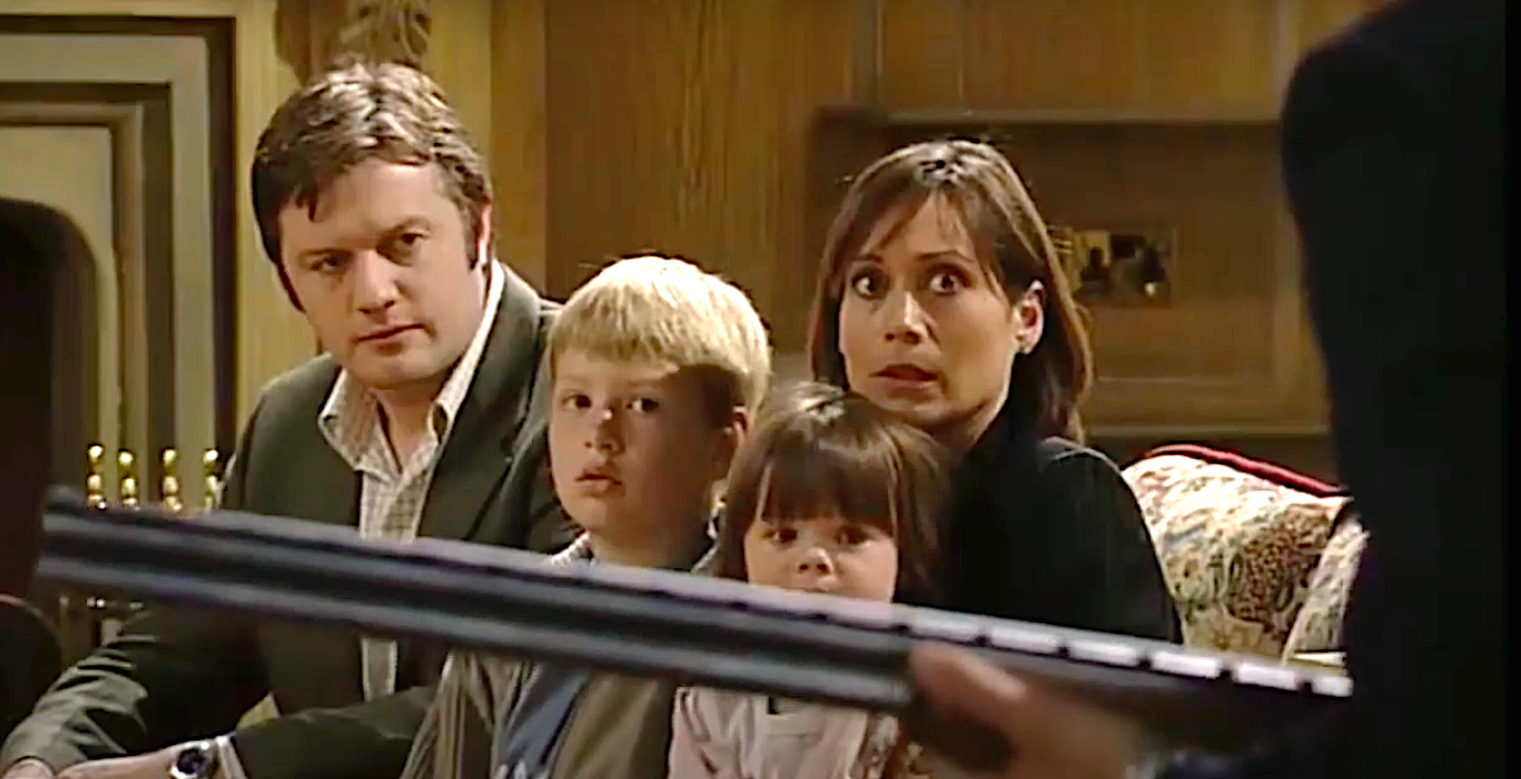 Scott holds Zoe and the children hostage with a shotgun