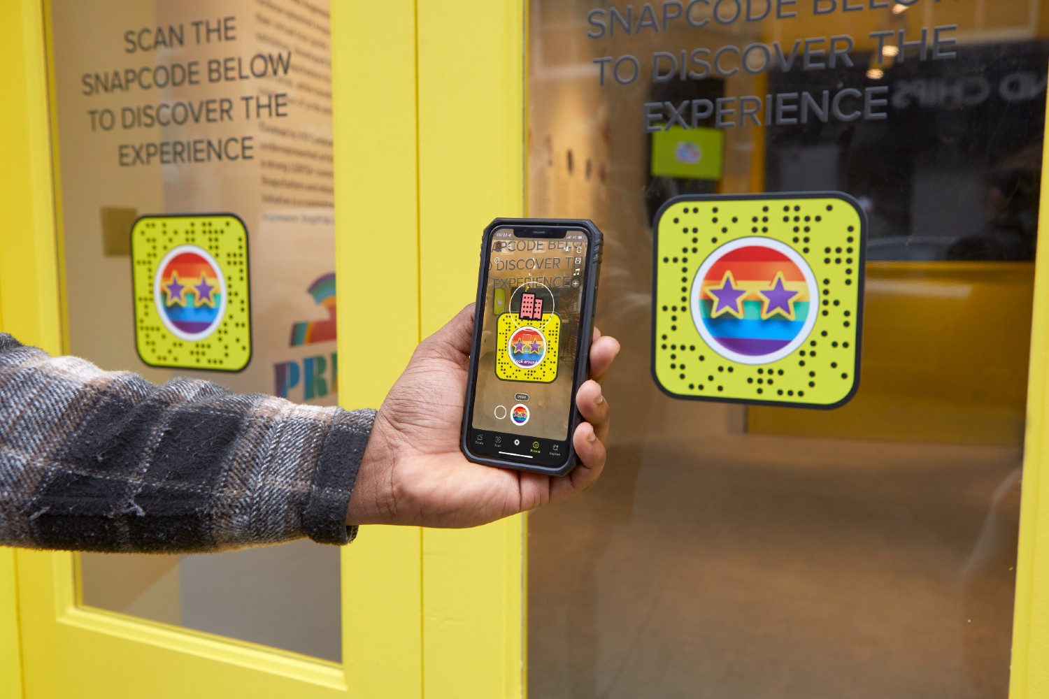 Phone scanning Snapchat's new rainbow-splashed Snapcode for Pride month