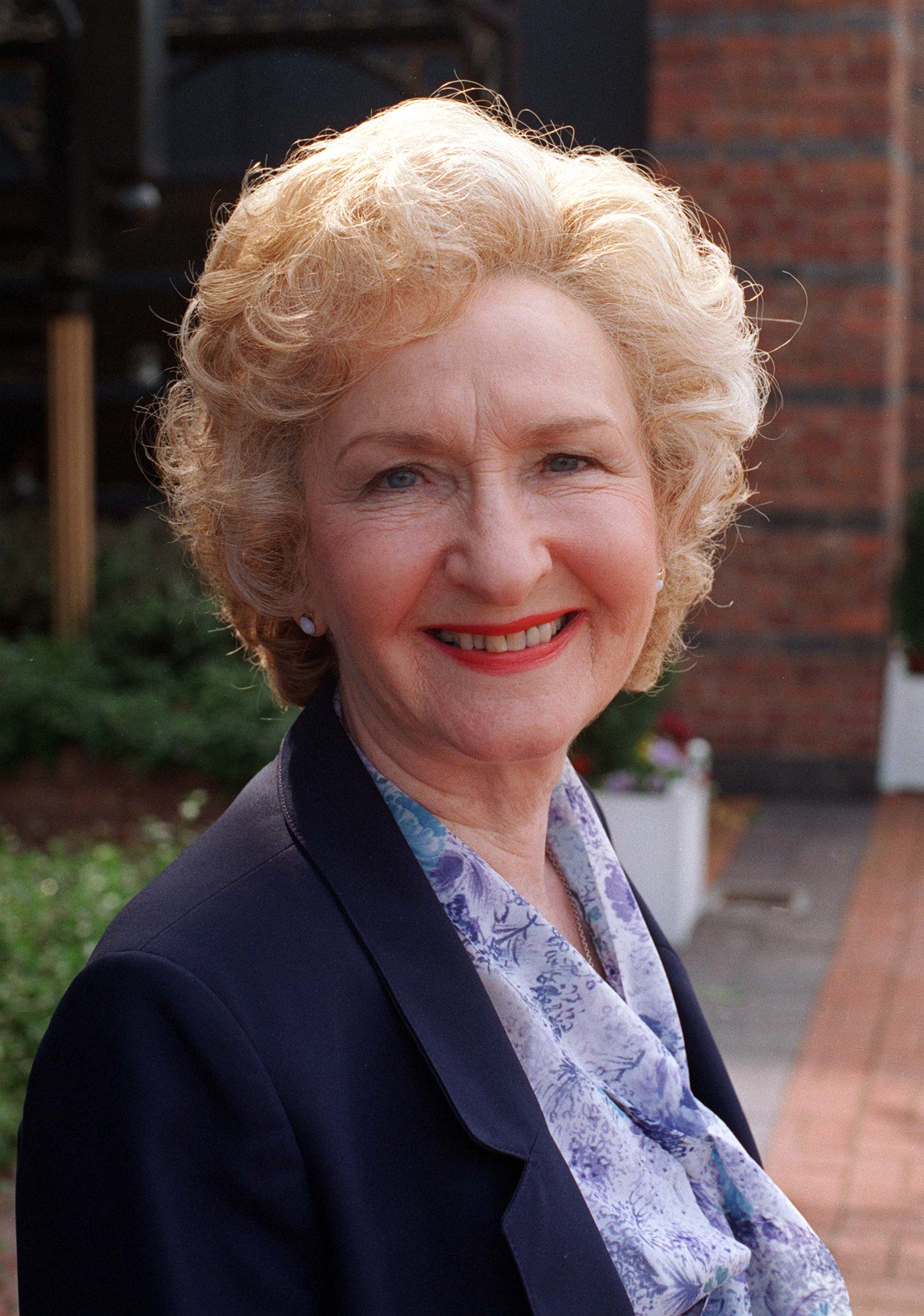 Emily Bishop smiles in Coronation Street promo shot