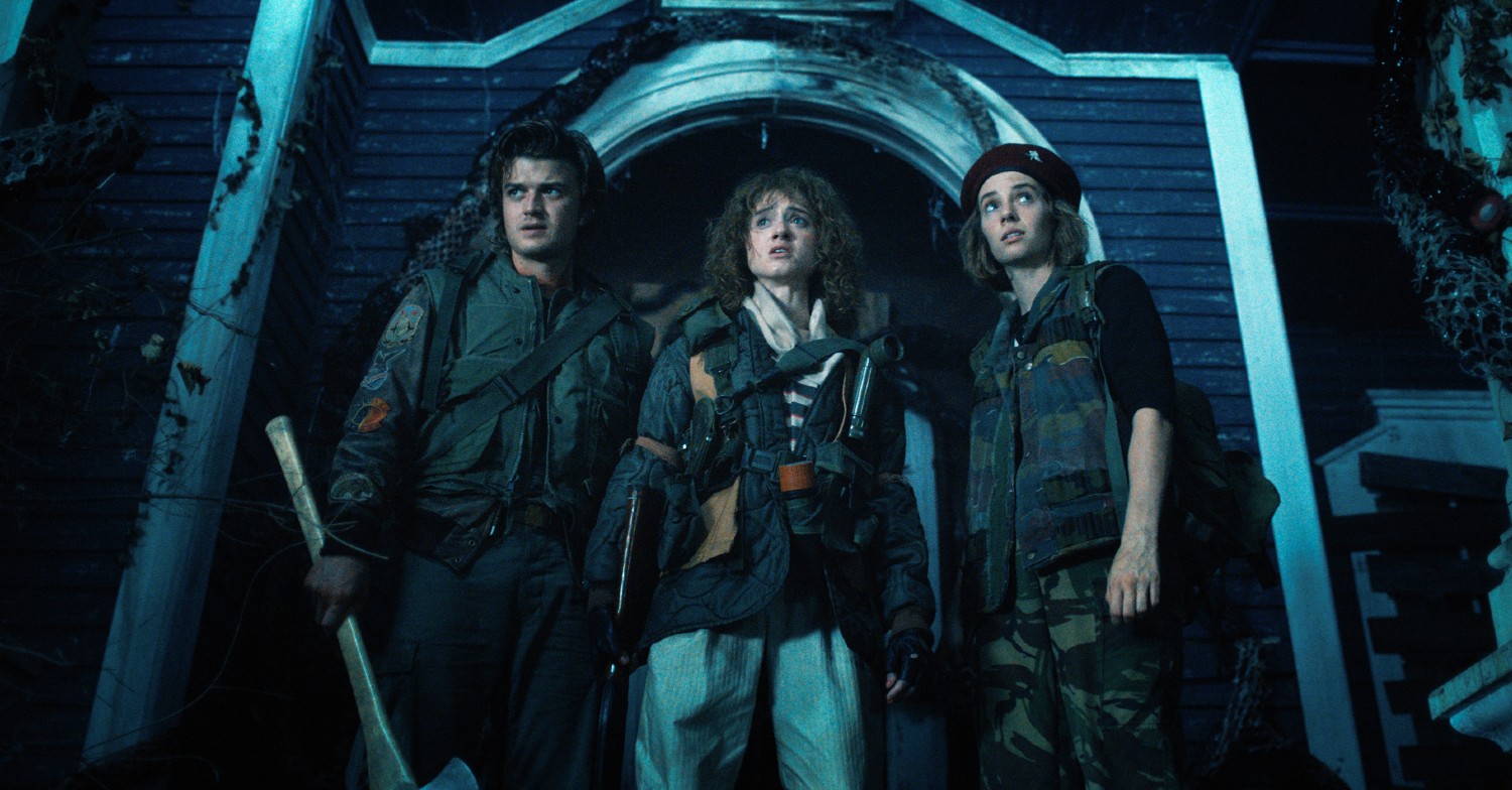 Nancy, Steve and Robin wearing army clothes in Stranger Things