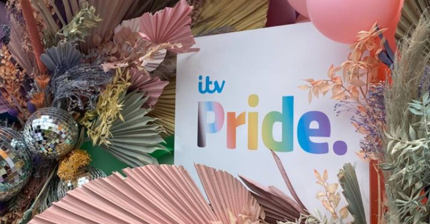 A sign displayed on the ITV Pride float