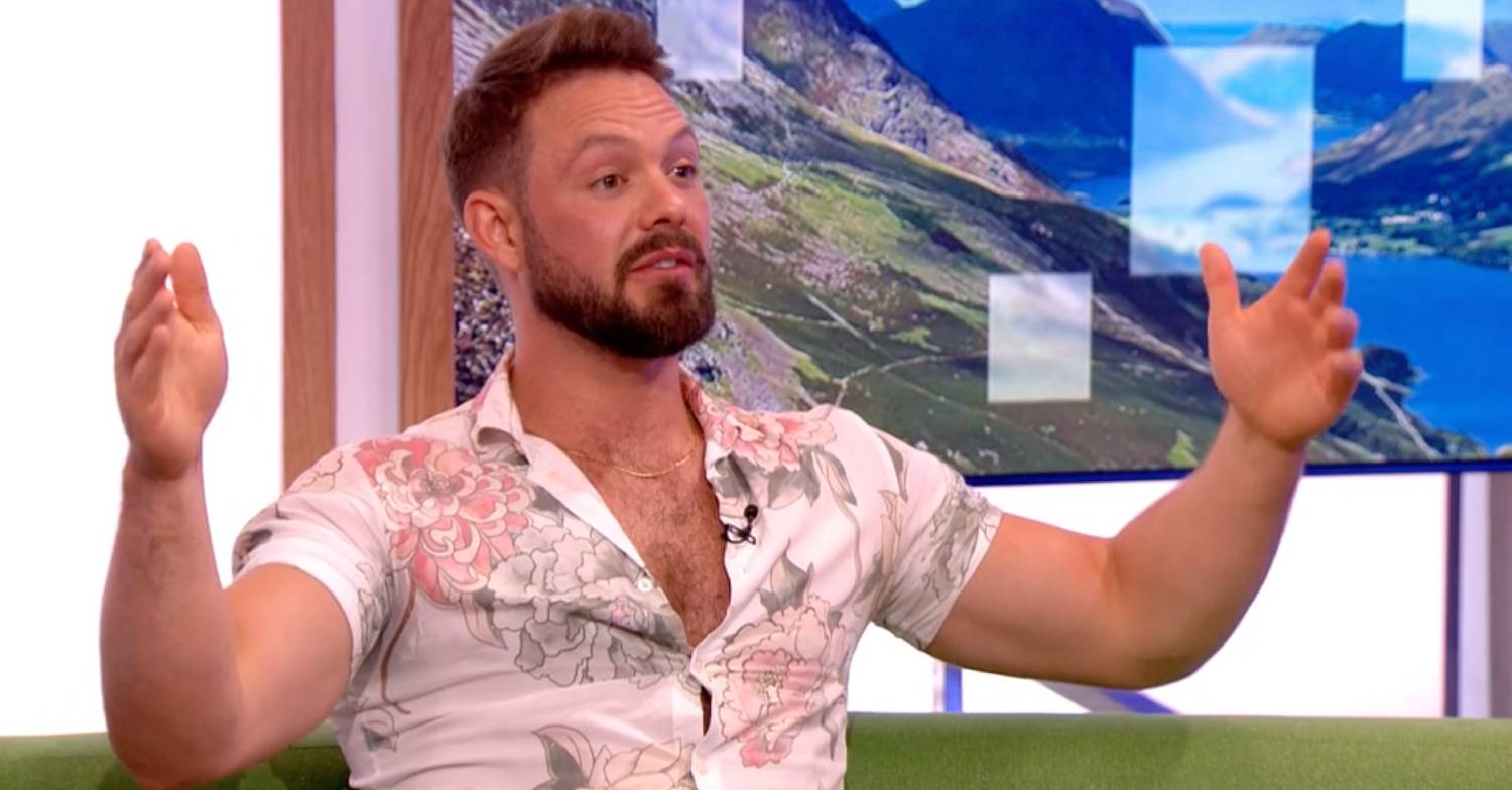 John Whaite demonstrates how big he expects tellies to be