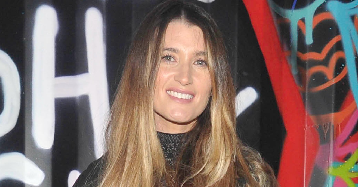 Charley Webb smiling at event
