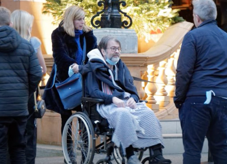 Kate Garraway pushes husband Derek in a wheelchair