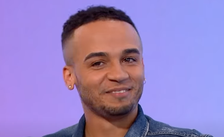 Aston Merrygold smiles as his interview is cut short 
