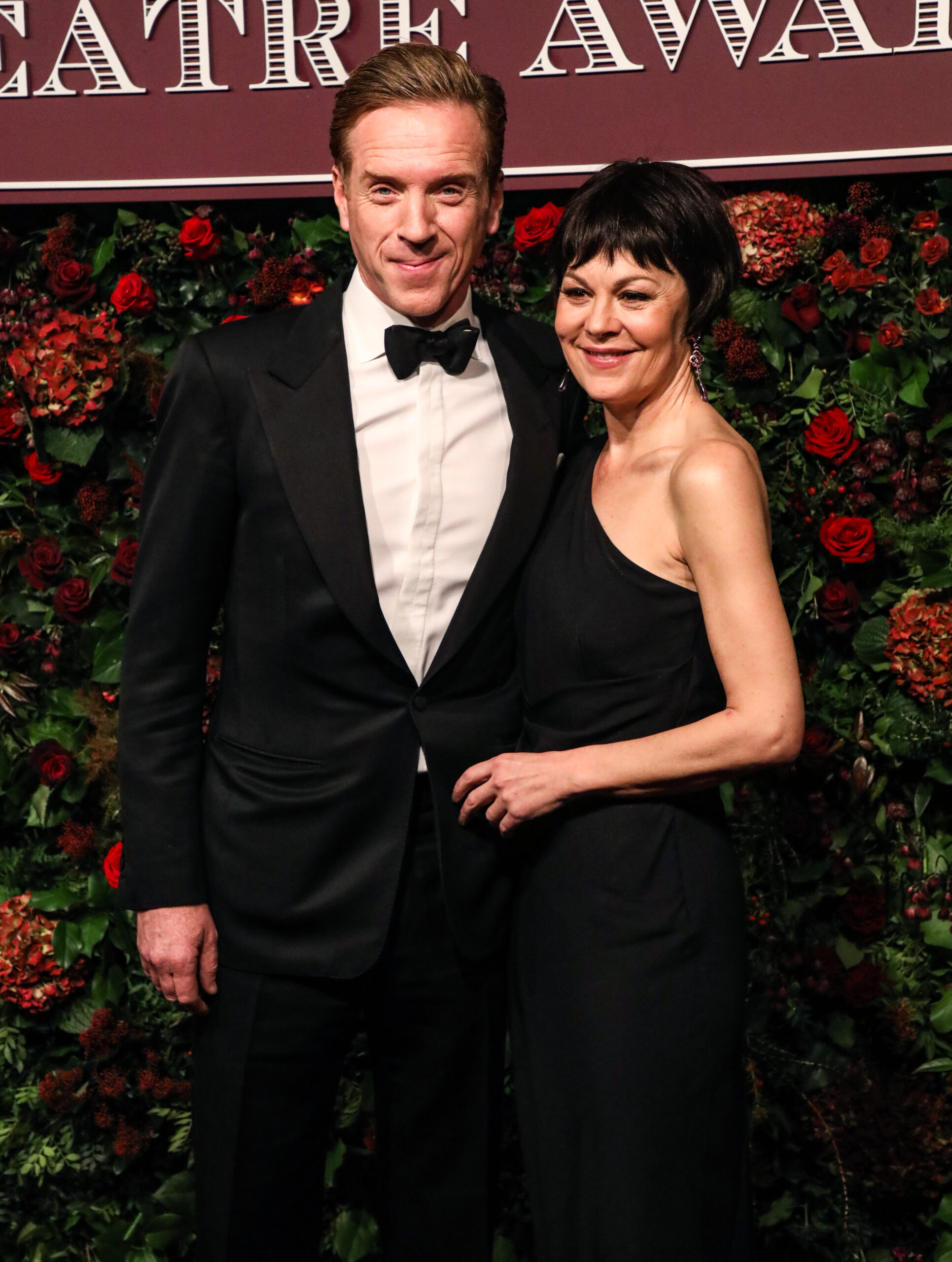 Damian Lewis and wife Helen on the red carpet smiling