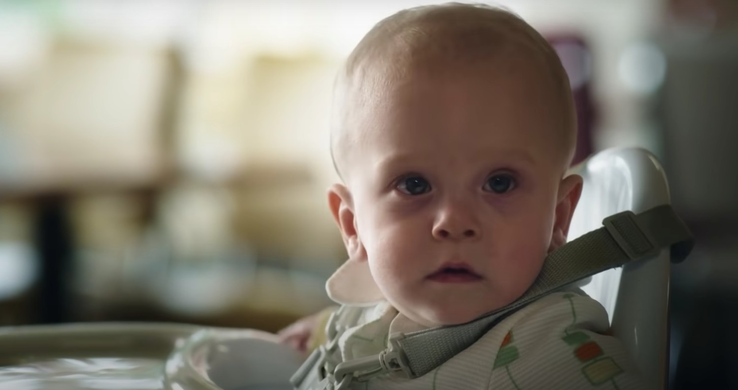 An infant frowning in The Baby