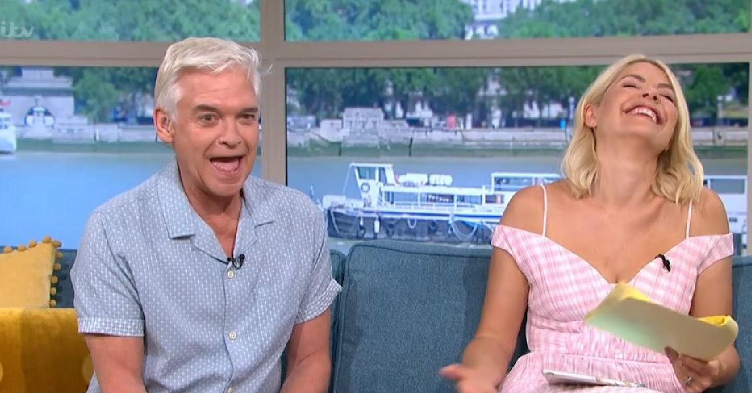 Phillip Schofield with his mouth open alongside Holly Willoughby laughing on This Morning today