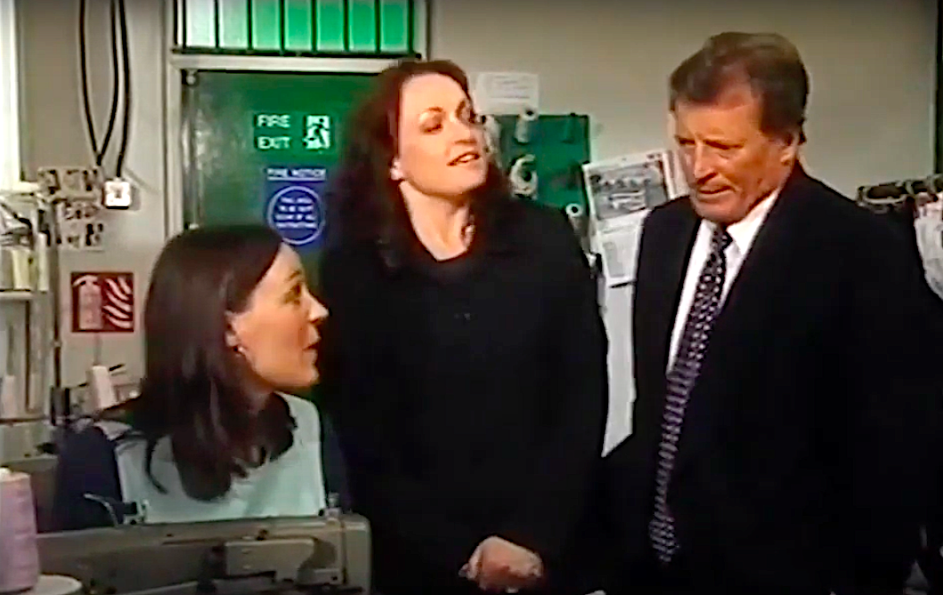 Karen sits at a sewing machine with Mike and Linda Baldwin watching