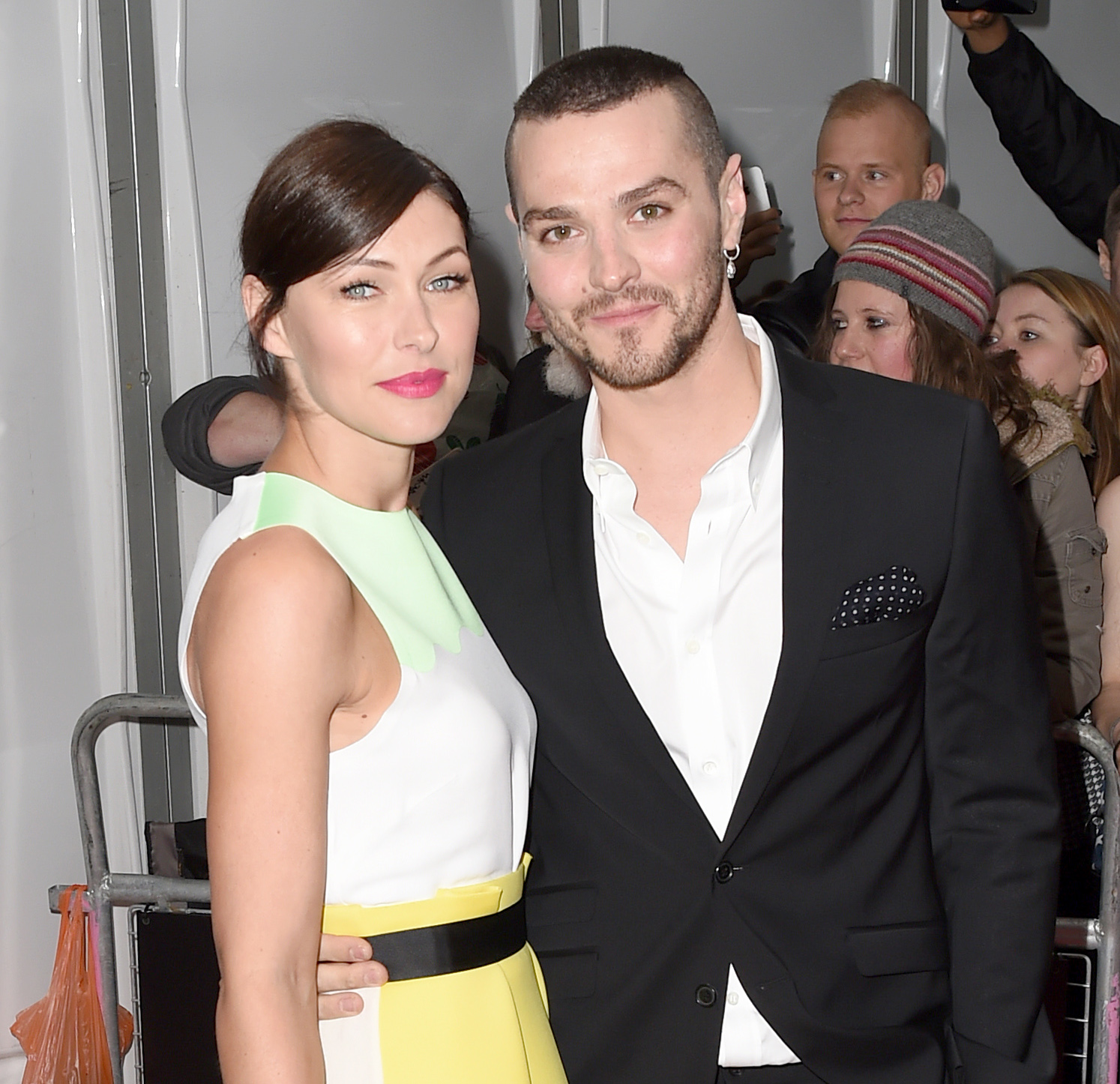 Emma and Matt Willis smiling on the red carpet